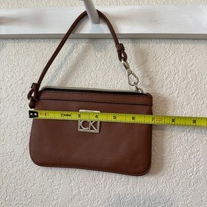 Calvin Klein tan leather wristlet